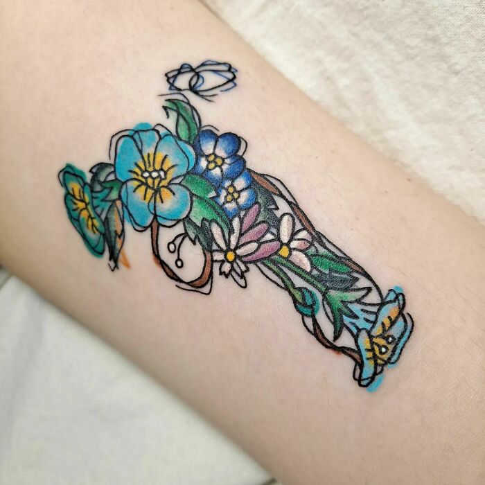 Watercolor Flower Gun tattoo