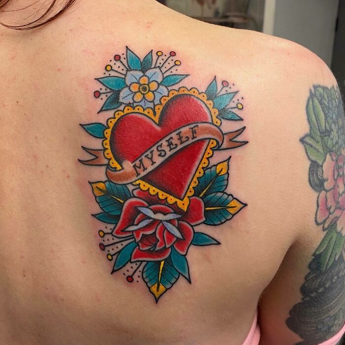 Self-love tattoo design featuring a heart with "myself" banner, surrounded by colorful flowers and leaves.