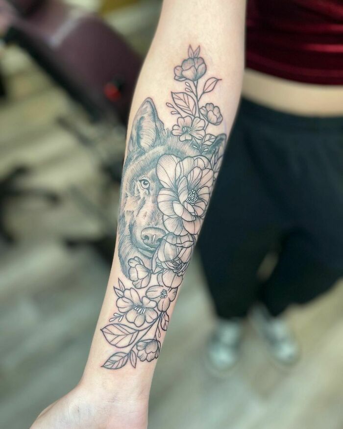 Flowers and wolf tattoo