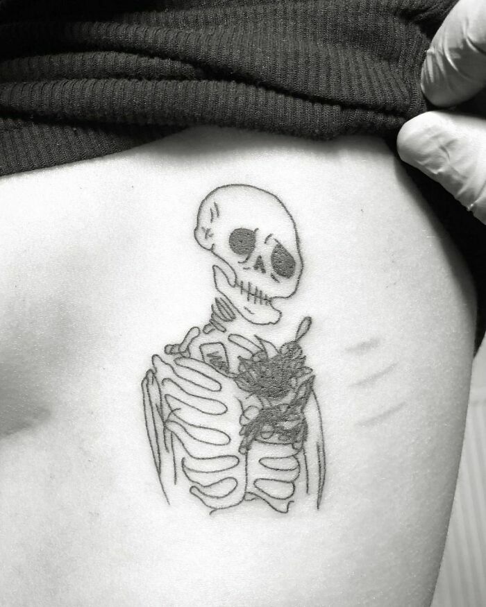Sad skeleton tattoo 