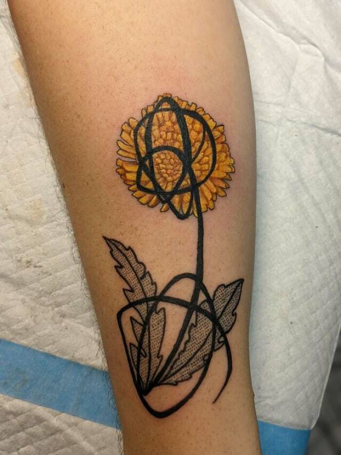 Yellow dandelion tattoo