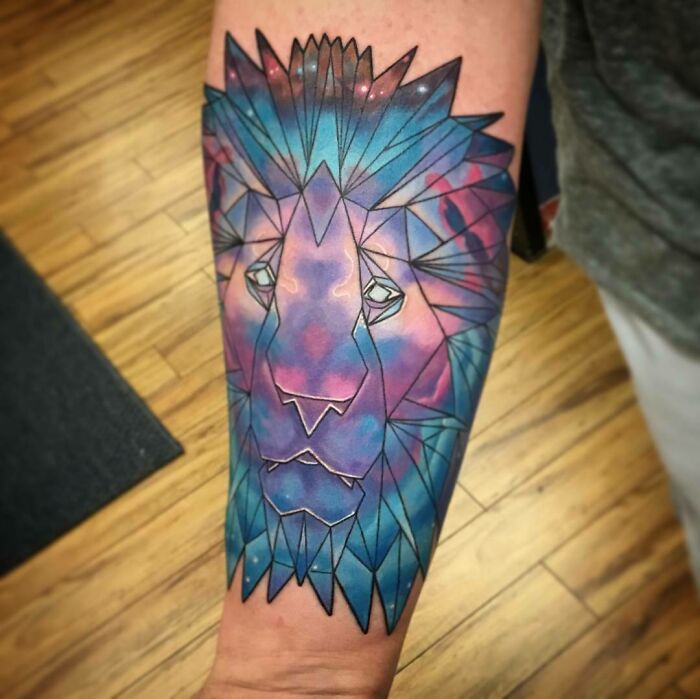 Geometric space lion arm tattoo