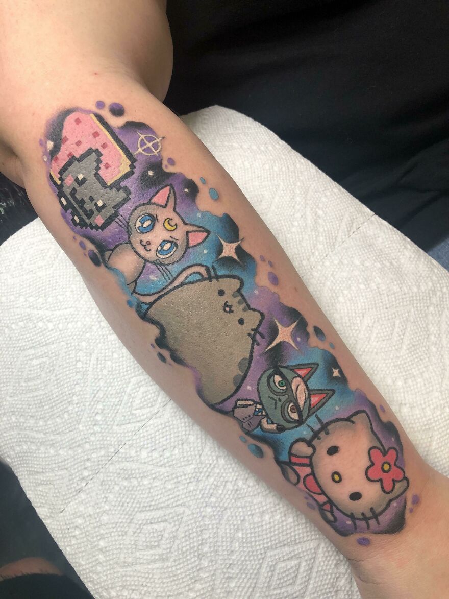 Cats in space arm tattoo