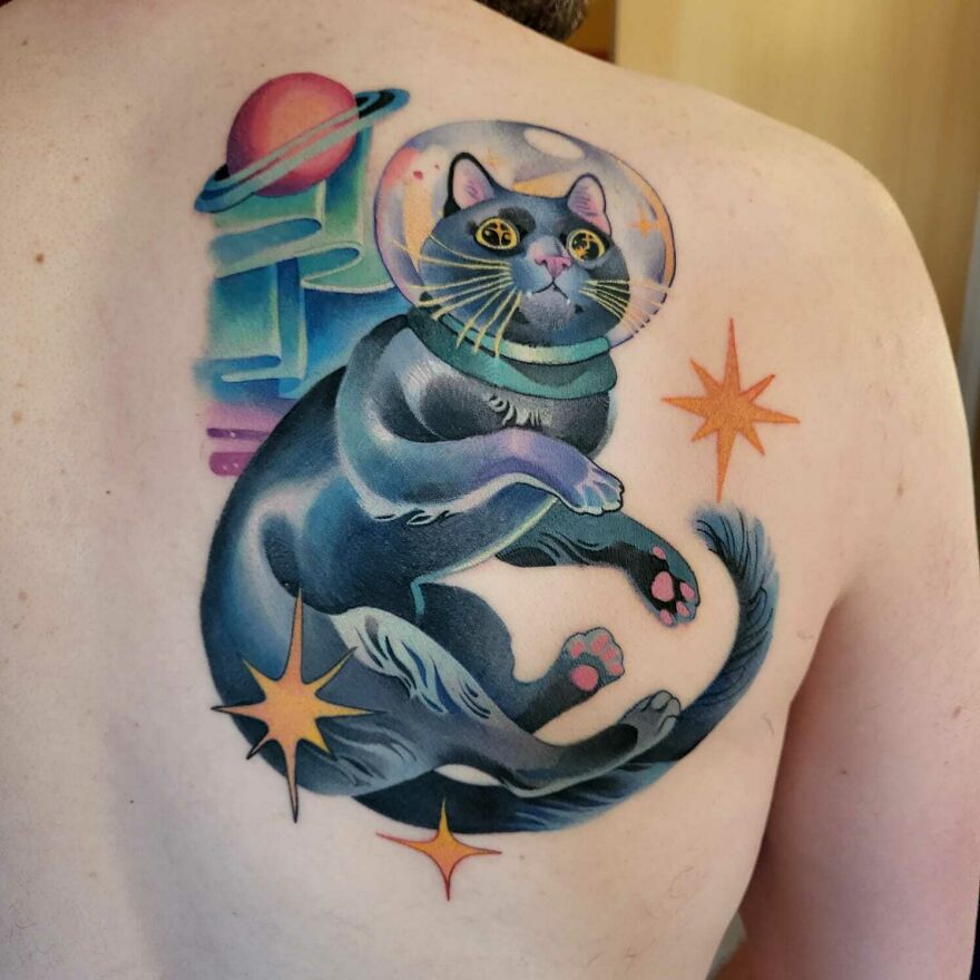 Astronaut cat in space back tattoo