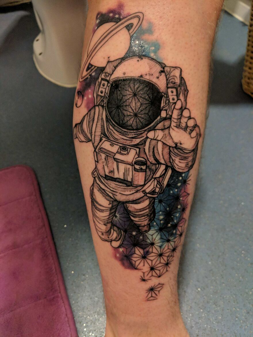 Astronaut in space tattoo