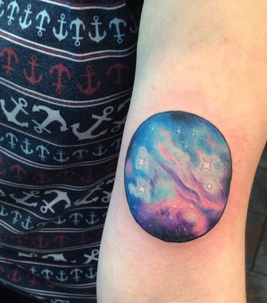 Galaxy circle forearm tattoo