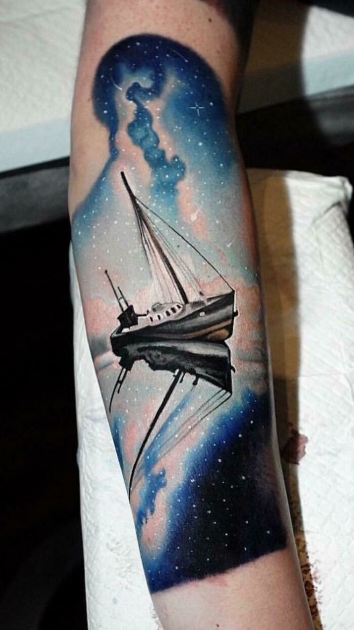 Landscape, space themed sleeve tattoo