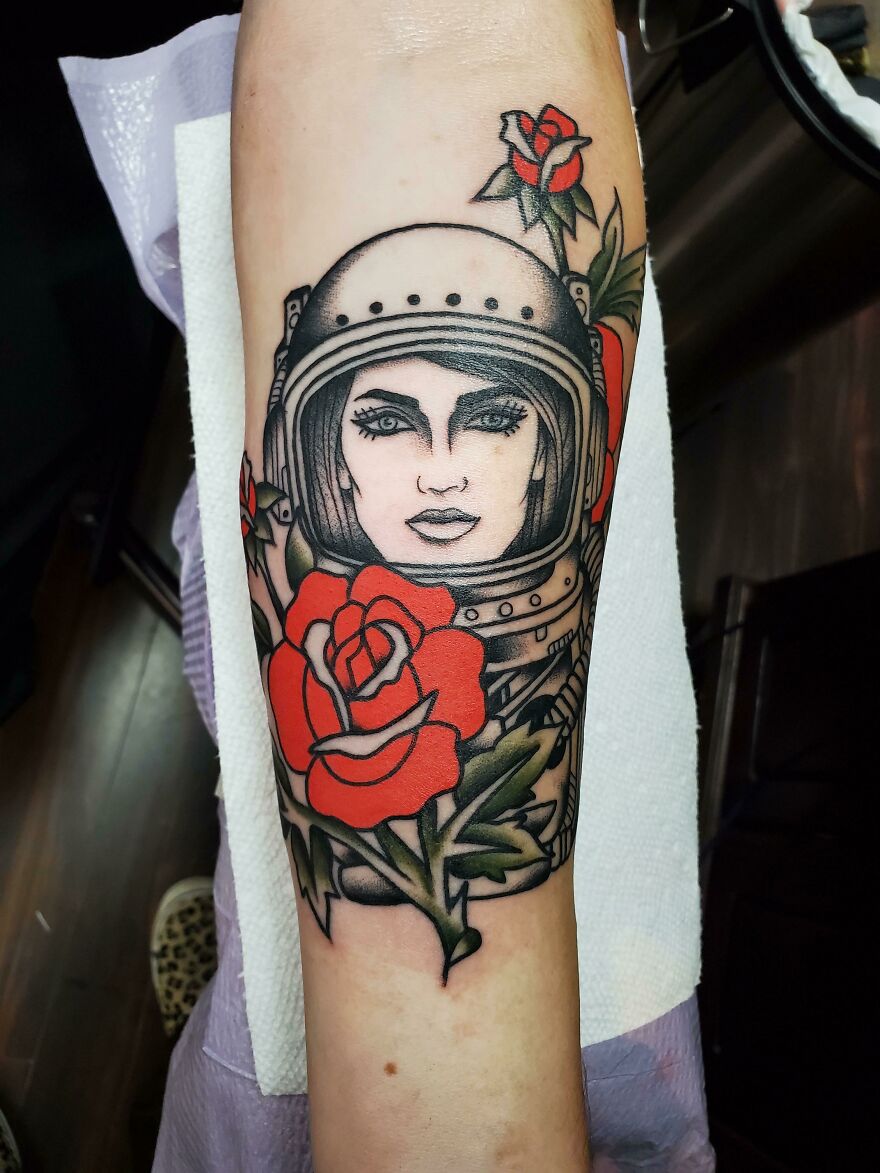 Space woman with red roses tattoo