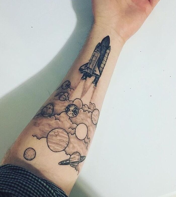 Space and rocket arm tattoo