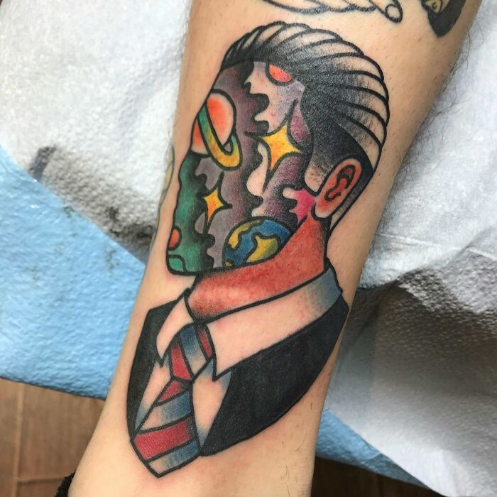 Space man arm tattoo