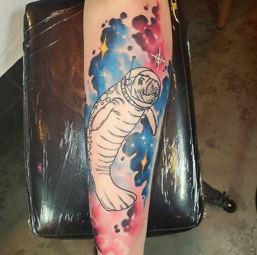 Manatee in space tattoo