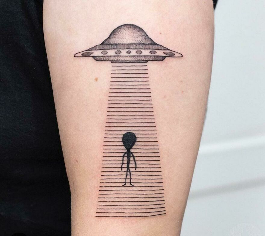 UFO arm tattoo
