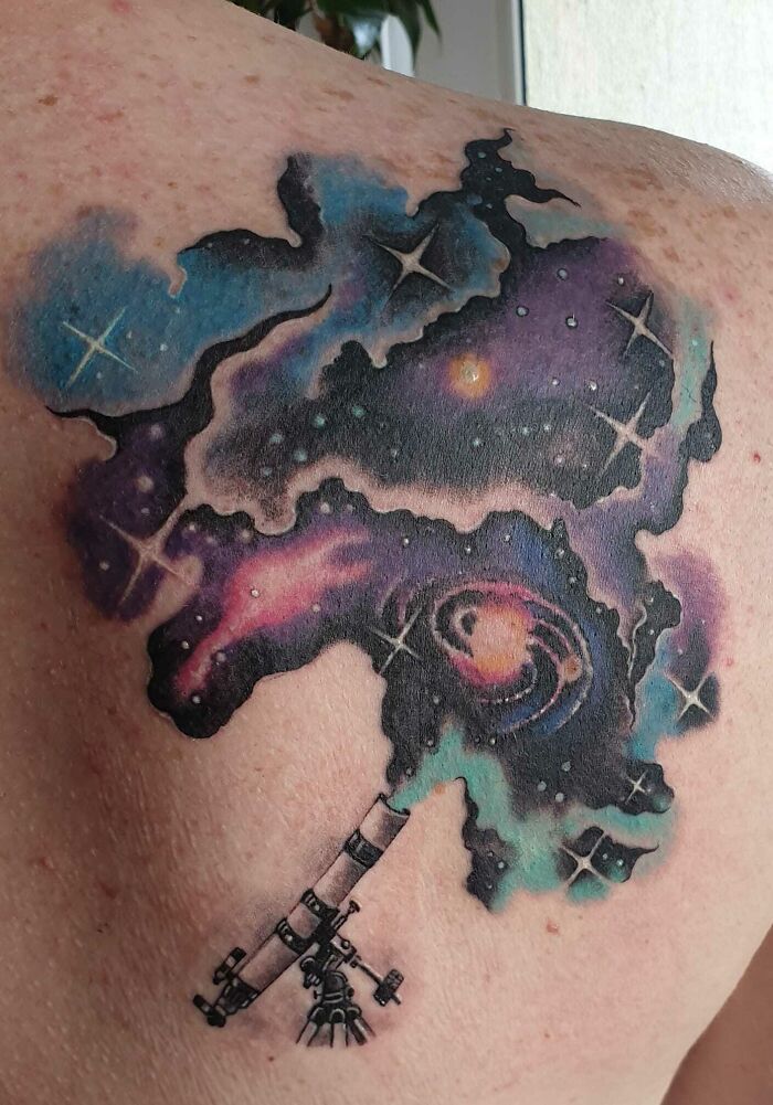 Telescope and galaxy back tattoo