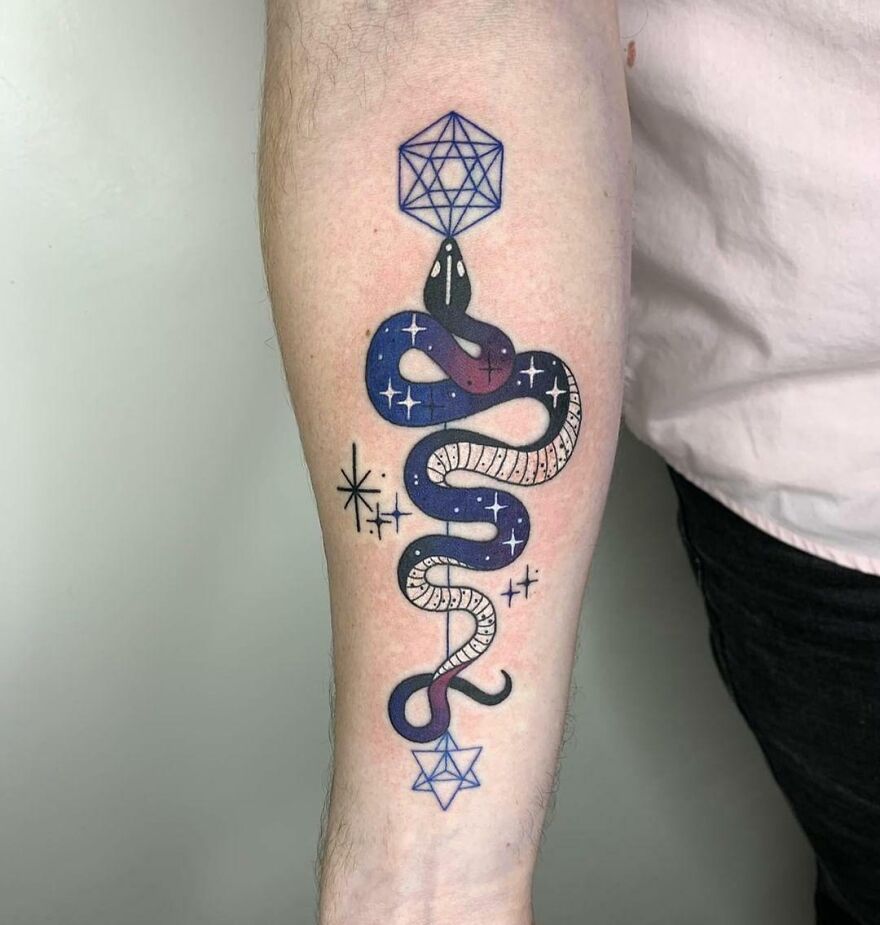 Galaxy snake forearm tattoo