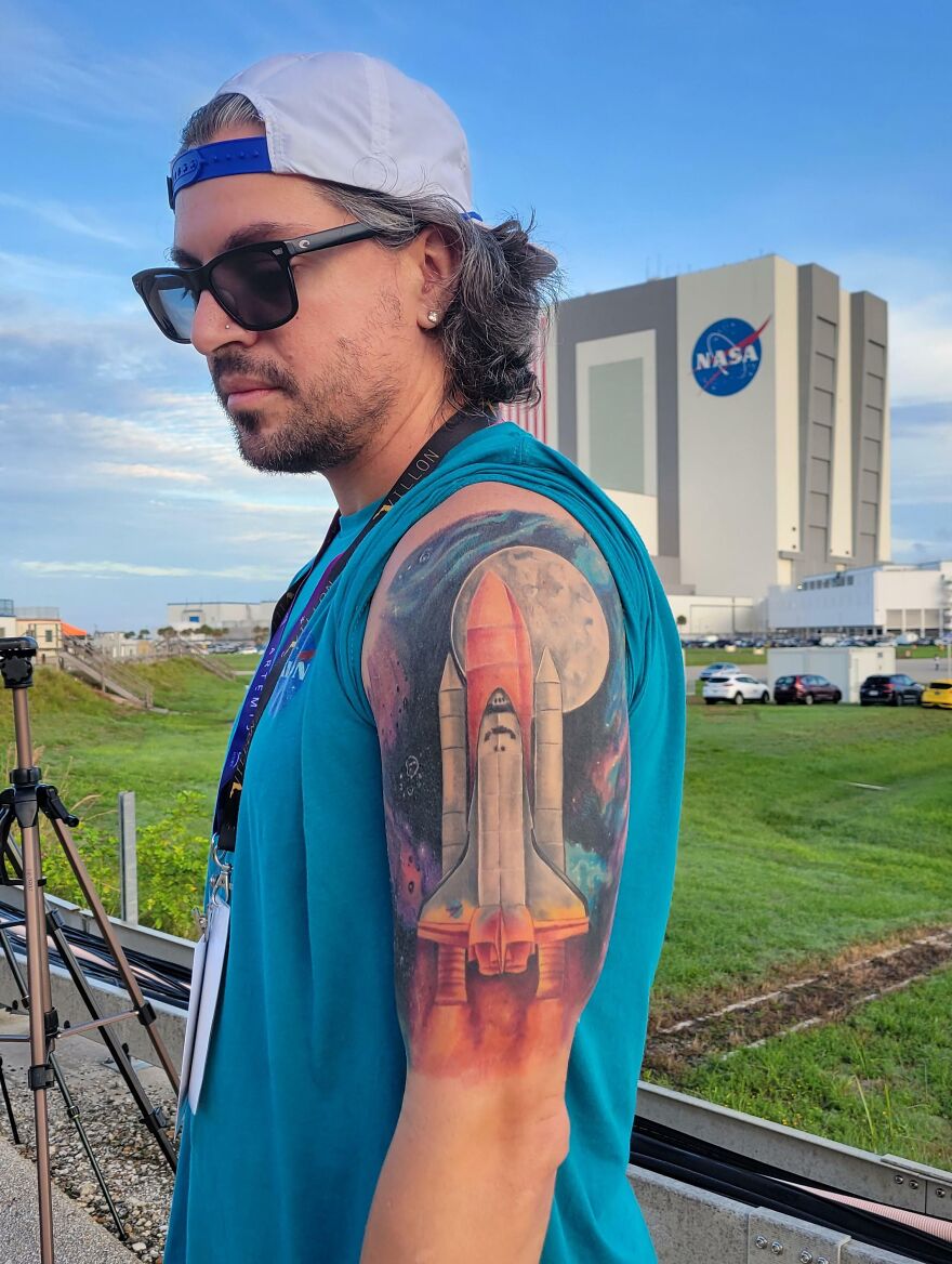 Shuttle, moon and galaxy arm tattoo