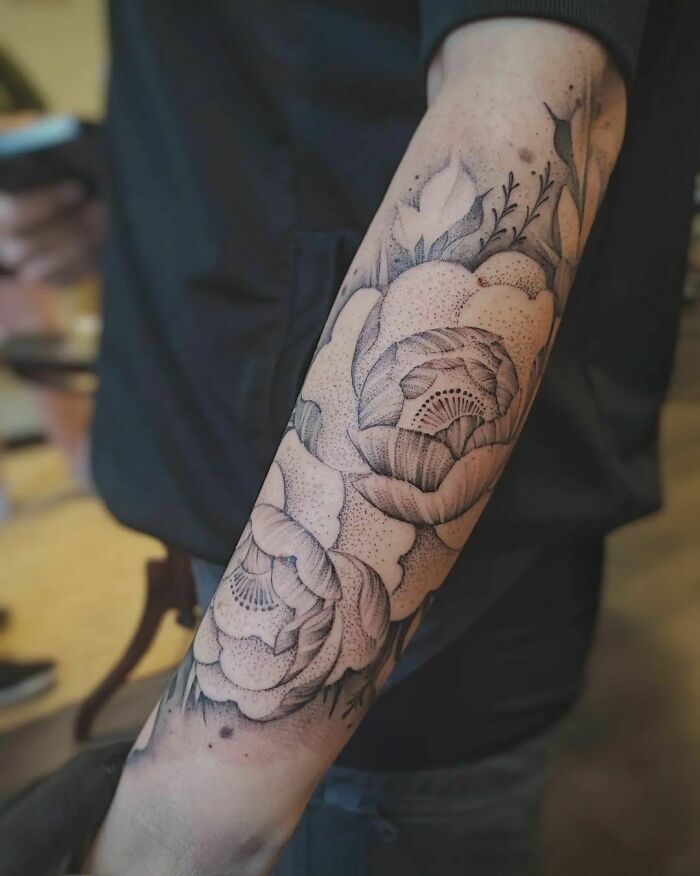 Giant flower tattoo on hand
