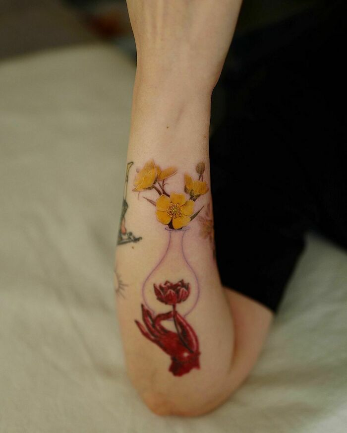 Yellow Flowers In Pottery tattoo