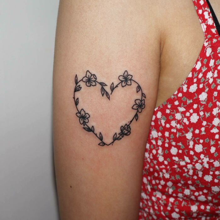 Heart shaped flowers tattoo