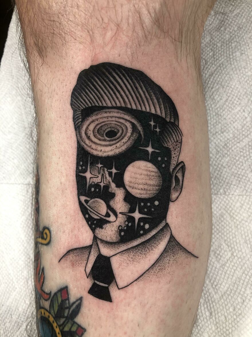 Space face tattoo
