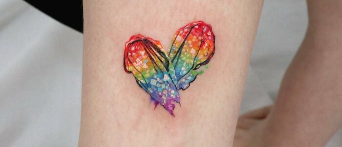 Colorful love heart leg tattoo