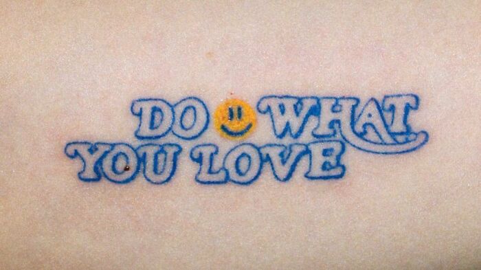"Do What You Love" with smiley face tattoo 