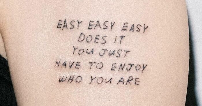 "You Just Have To Enjoy Who You Are" phrase tattoo 