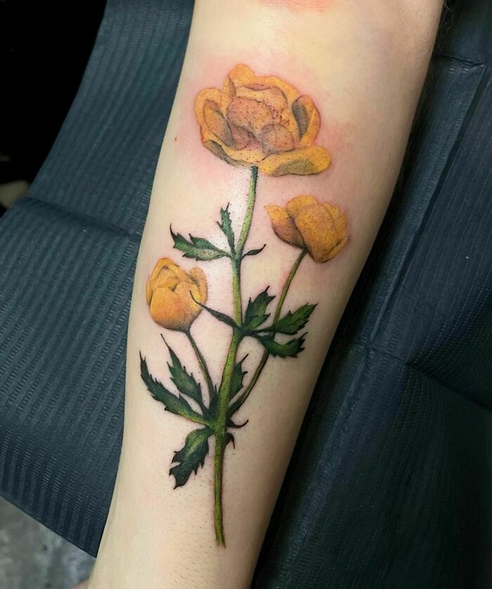Yellow flower tattoo