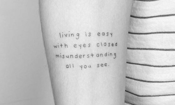 Living is easy with eyes closed misunderstanding all you see quote arm tattoo