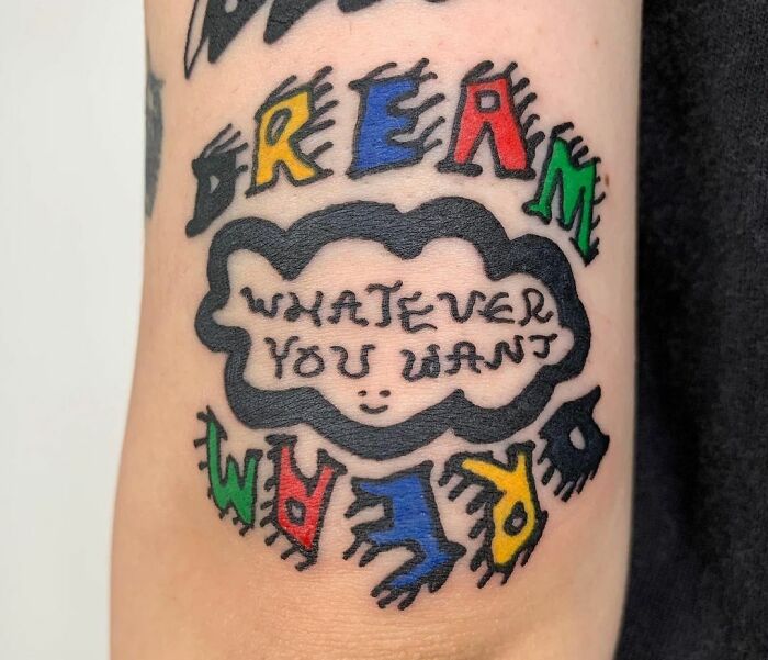 Colorful dream whatever you want quote arm tattoo