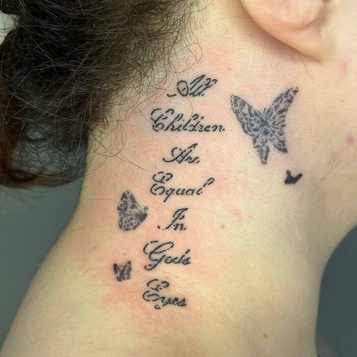 Neck tattoo featuring self-love message with butterflies.