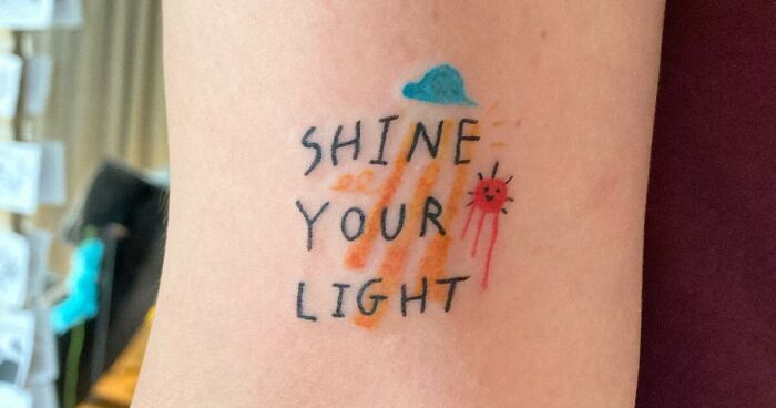 "Shine Your Light" phrase with cloud and sun tattoo 
