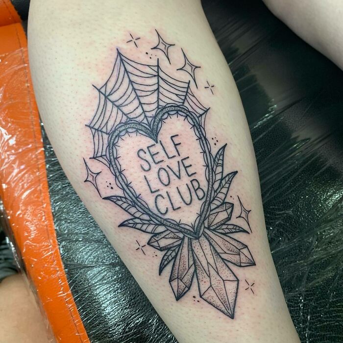 Self love club quote in heart shaped mirror arm tattoo