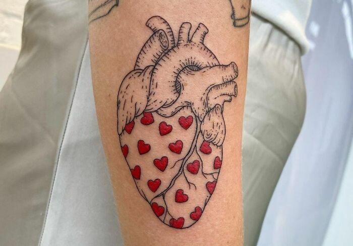 heart on hearts arm tattoo