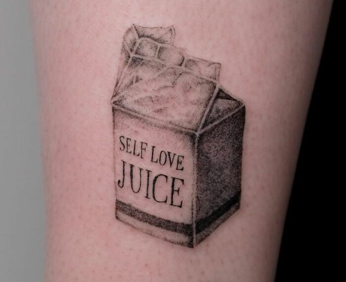 Self love carton juice arm tattoo