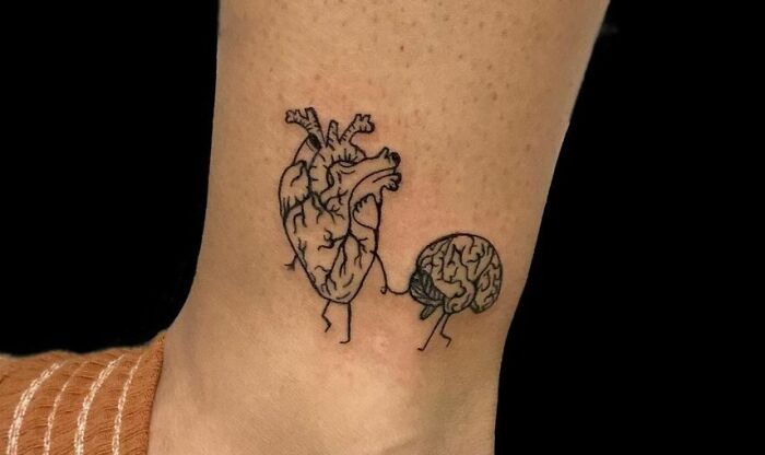 heart guides brain leg tattoo