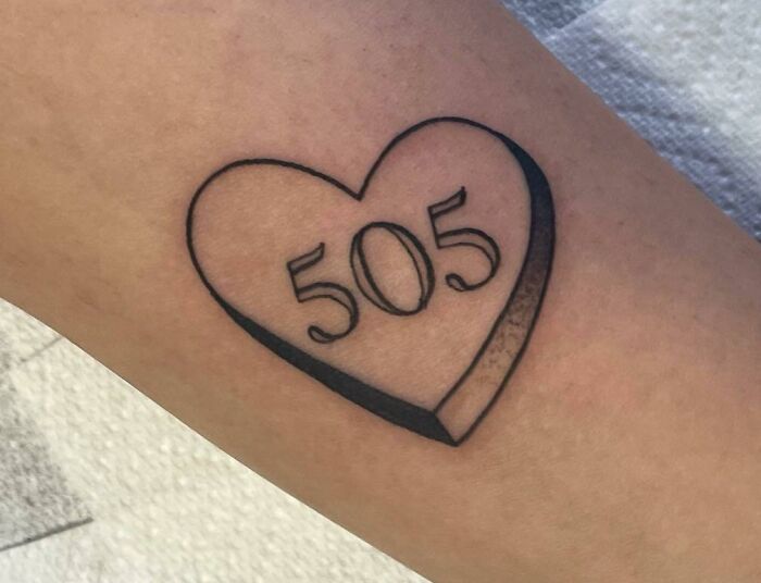 505 in heart shape arm tattoo