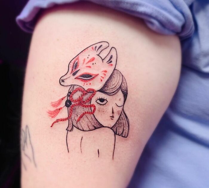 Self-love tattoo of a woman with a fox mask, emphasizing personal empowerment and artistic expression.