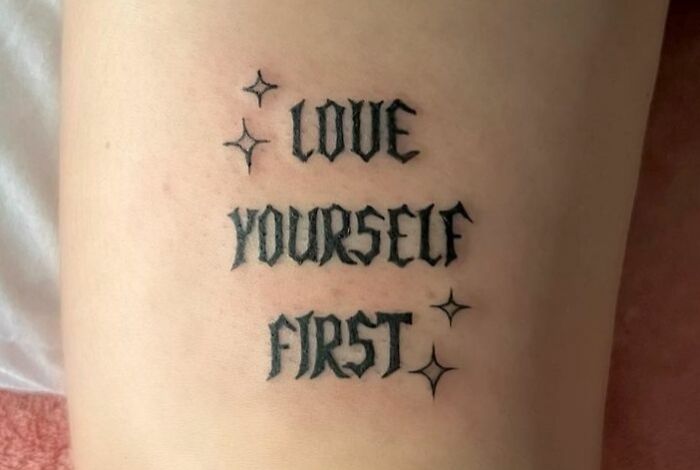 "Love Yourself First" phrase tattoo 