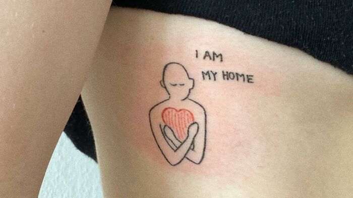 "I Am My Home" person hugging heart tattoo 