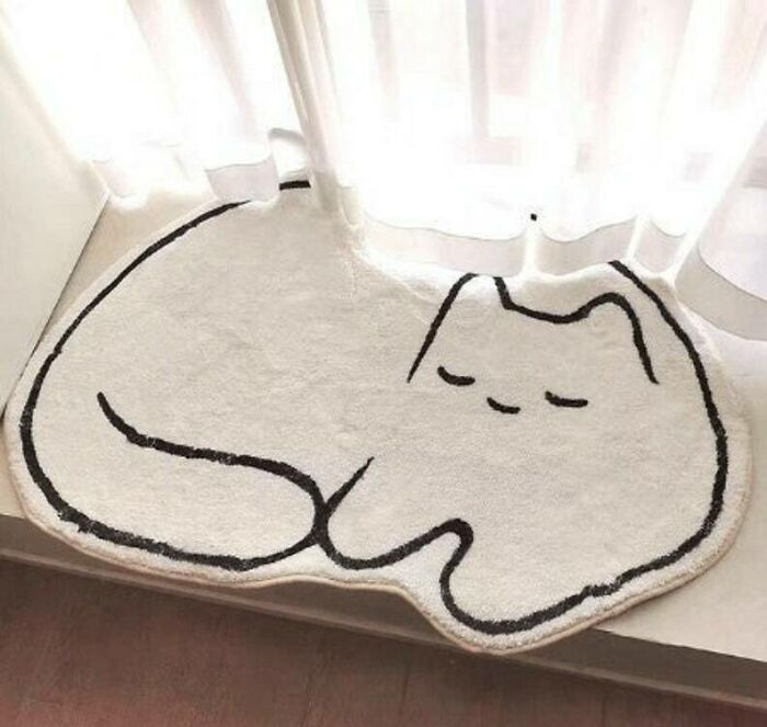Cute white cat sleeping rug