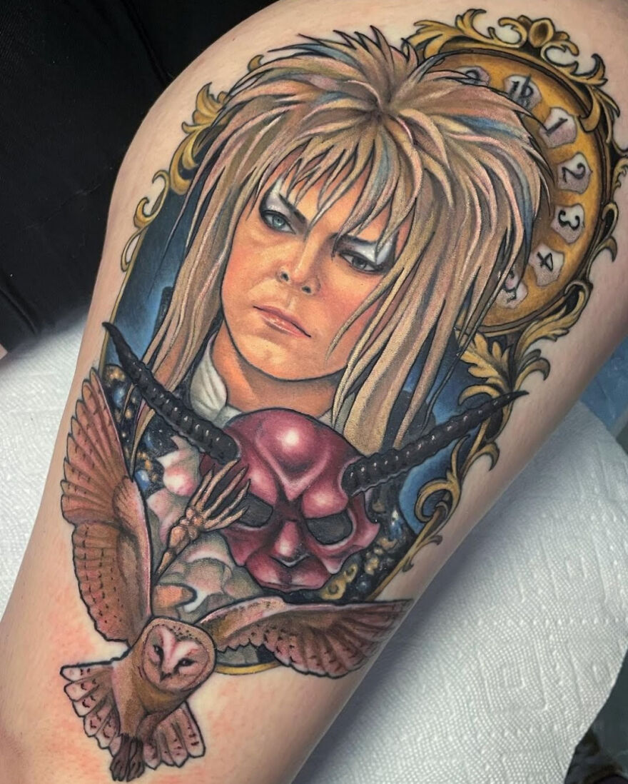 Colorful goblin king with owl tattoo