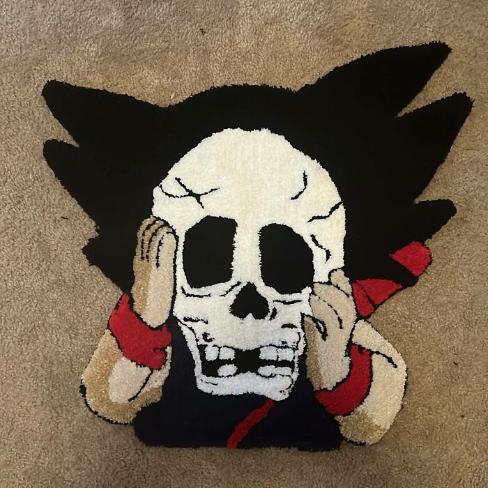 Kid Goku holding skull rug