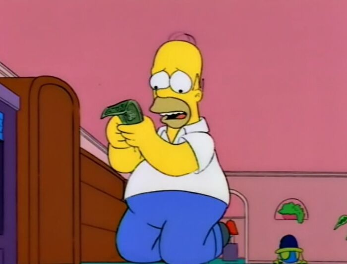 Homer holding dollar bill