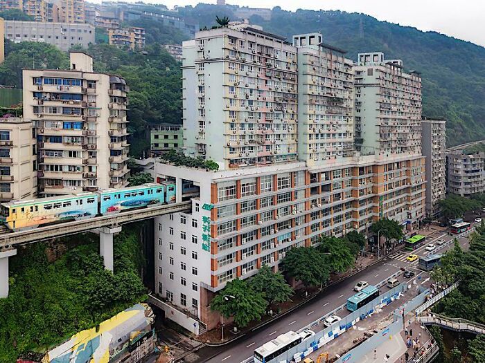 Monorail Passes Through Liziba Station In Chongqing, China. It Passes Through The Sixth And Eighth Floors Of The 19-Story Apartment Building