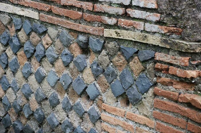 A Wall In Ancient Ostia Where The Bricks Were Laid According To The Scheme Called Opus Reticulatum, With Bricks Arranged Diagonally. The Ancient Romans Knew Earthquake Tremors Were Transmitted Diagonally And This Could Cope Better Than A Horizontal Pattern