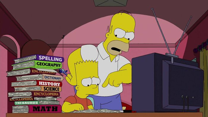 Homer doing homework with Bart 