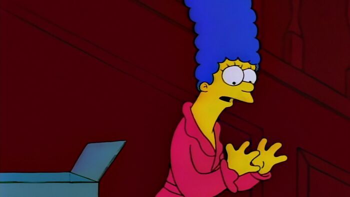 Marge is looking at her hands 