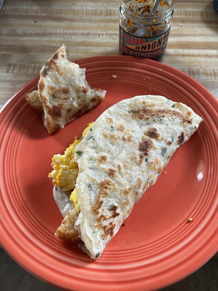 Say Hello To "I'm Nursing A New Year's Hangover" Breakfast. Taiwanese Green Onion Pancake, Hash Browns, Eggs And Chili Onion Crunch Um… Taco? Don’t Judge Me