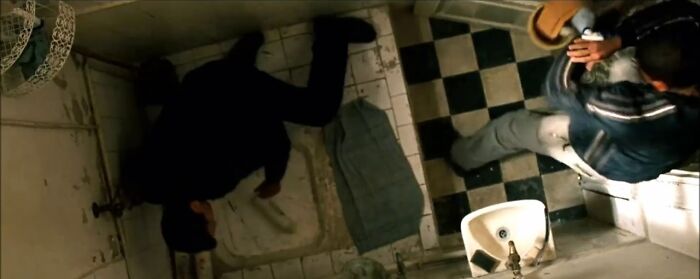 man lying on the bathroom floor 