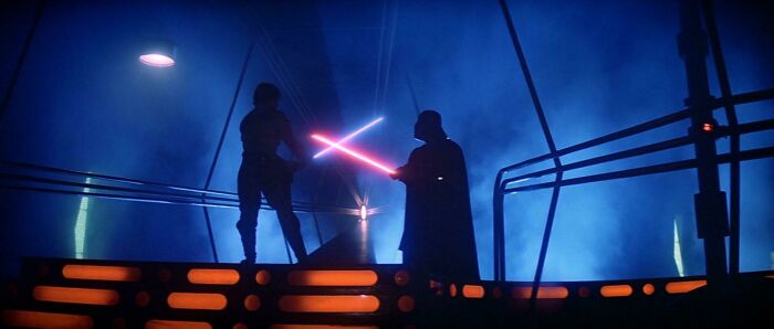 Luke Skywalker and Darth Vader fighting wit light swords 